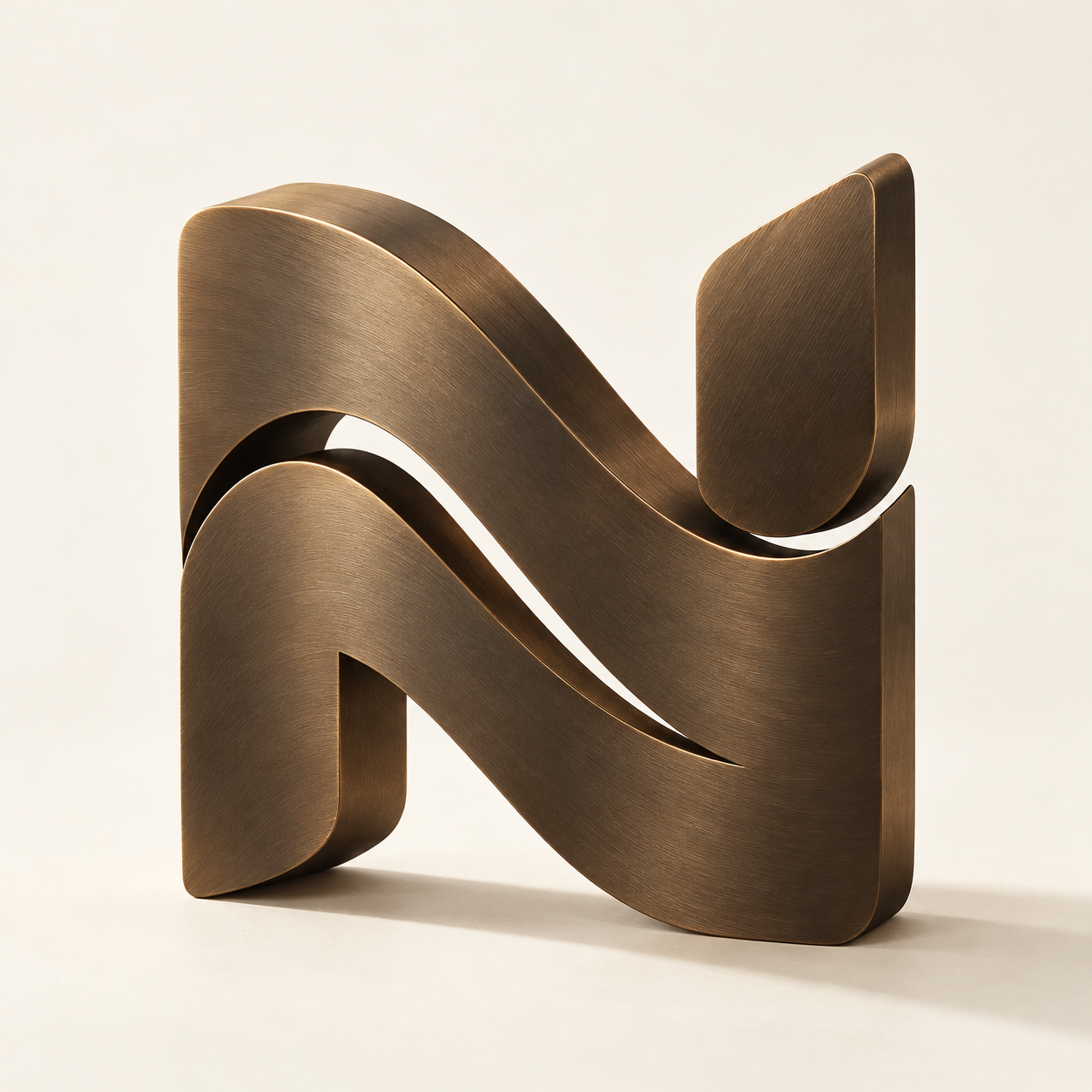 An abstract flowing N, sculpted in dark bronze